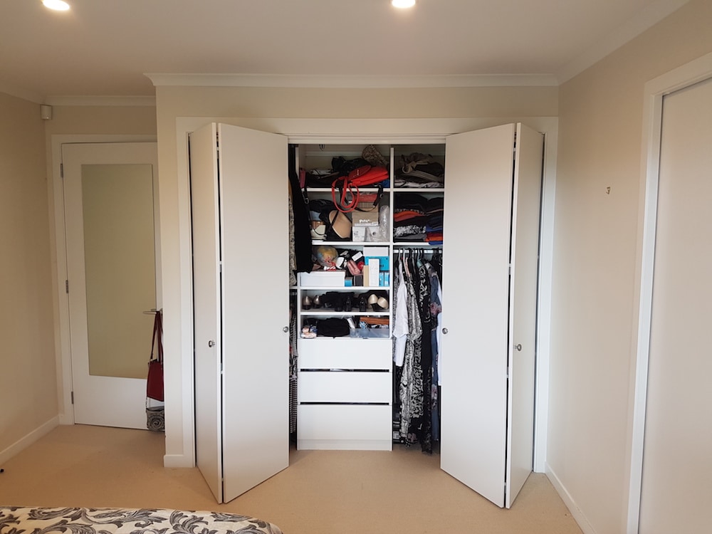 Built-in wardrobe with bifold doors